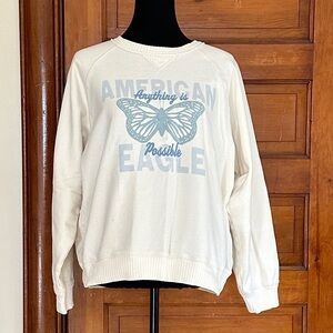 American Eagle Cream Pullover with Black Text Patch